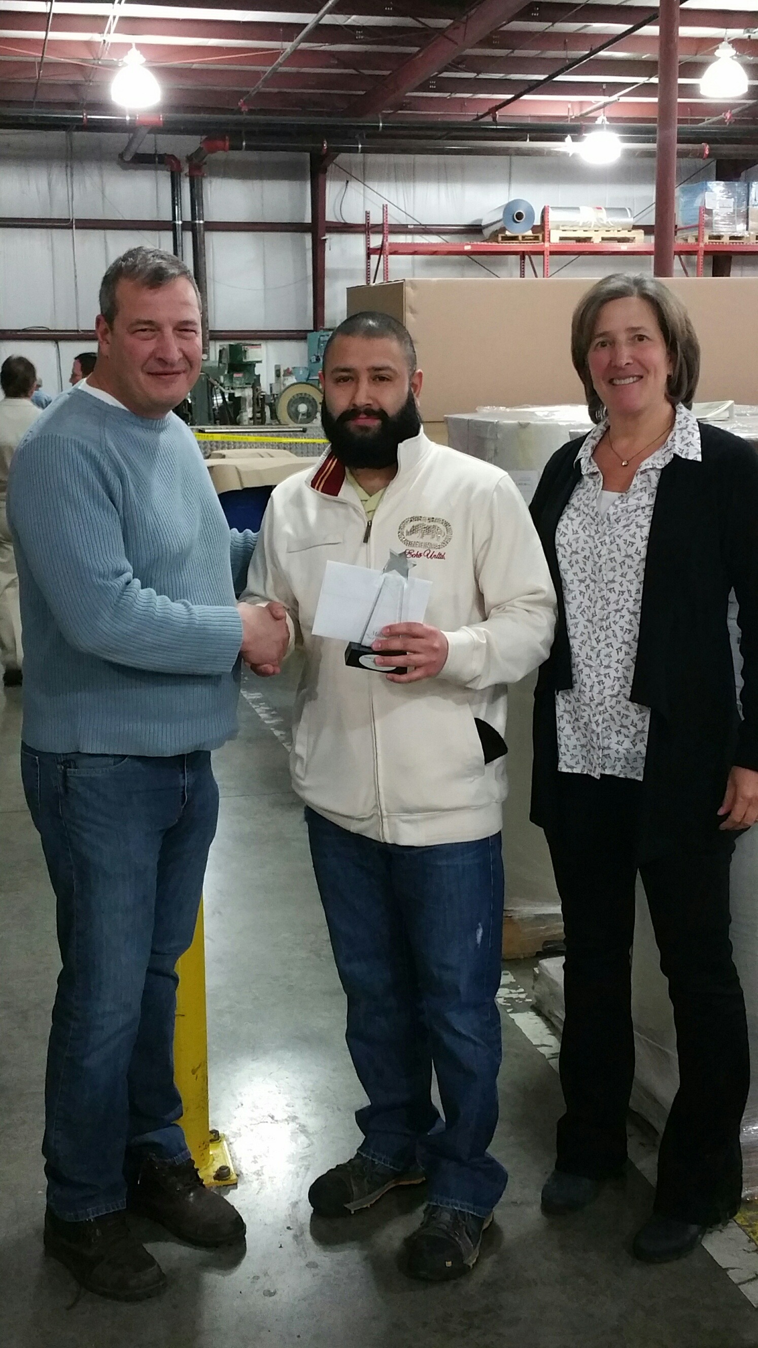 Fernando Cruz with company president Tony Trajkovich and vice president Lisa Trajkovich.
